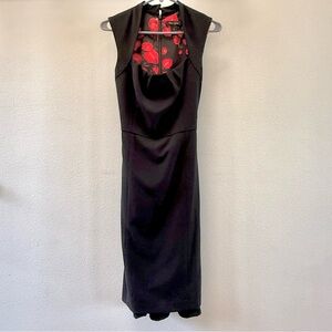 Elegant Black Sleeveless Dress with Red Floral Design Inside.